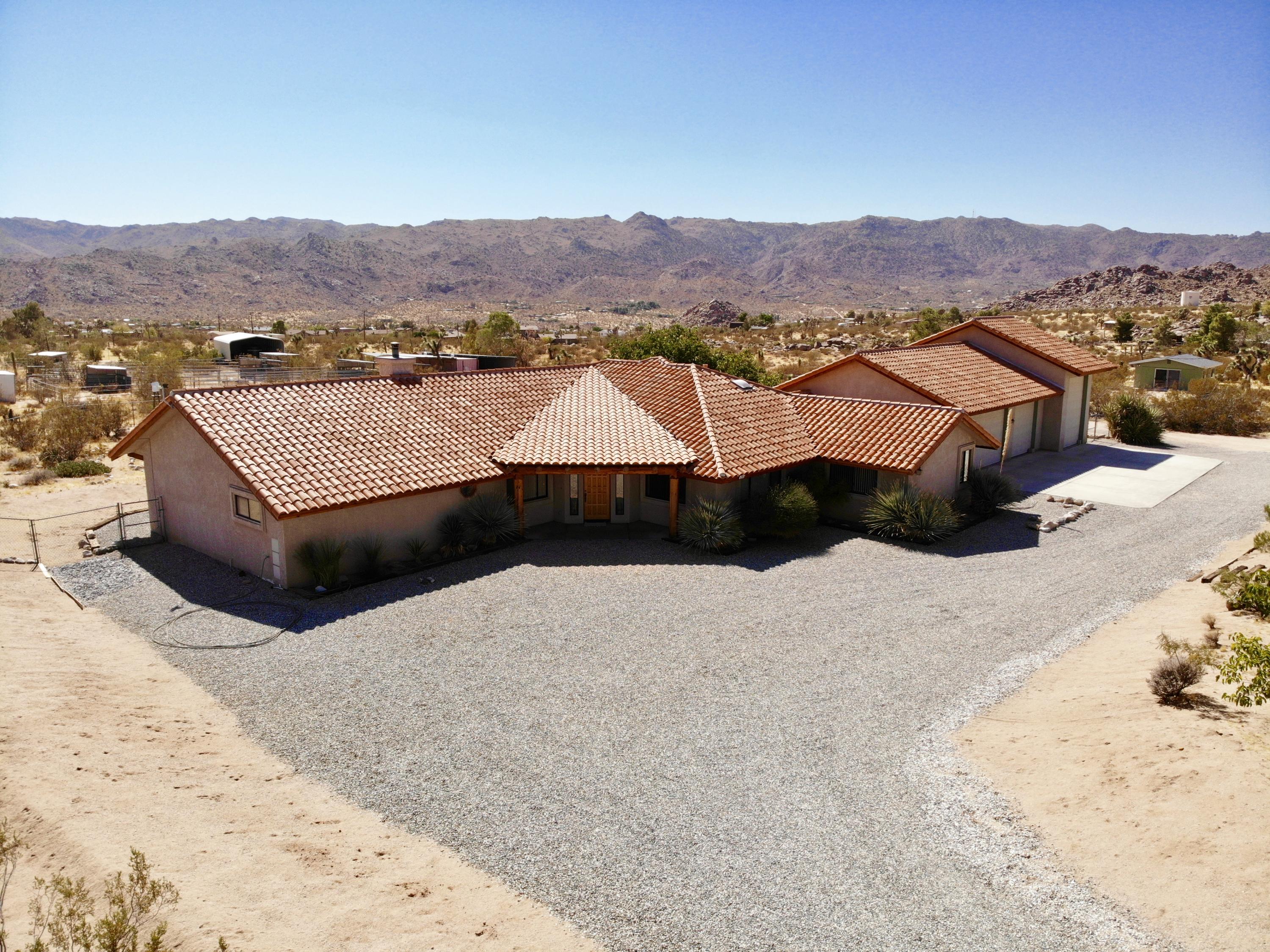 63533 Wagon Wheel Road Joshua Tree, CA 92252 - Photo 49 of 62 a view of a house with a mountain