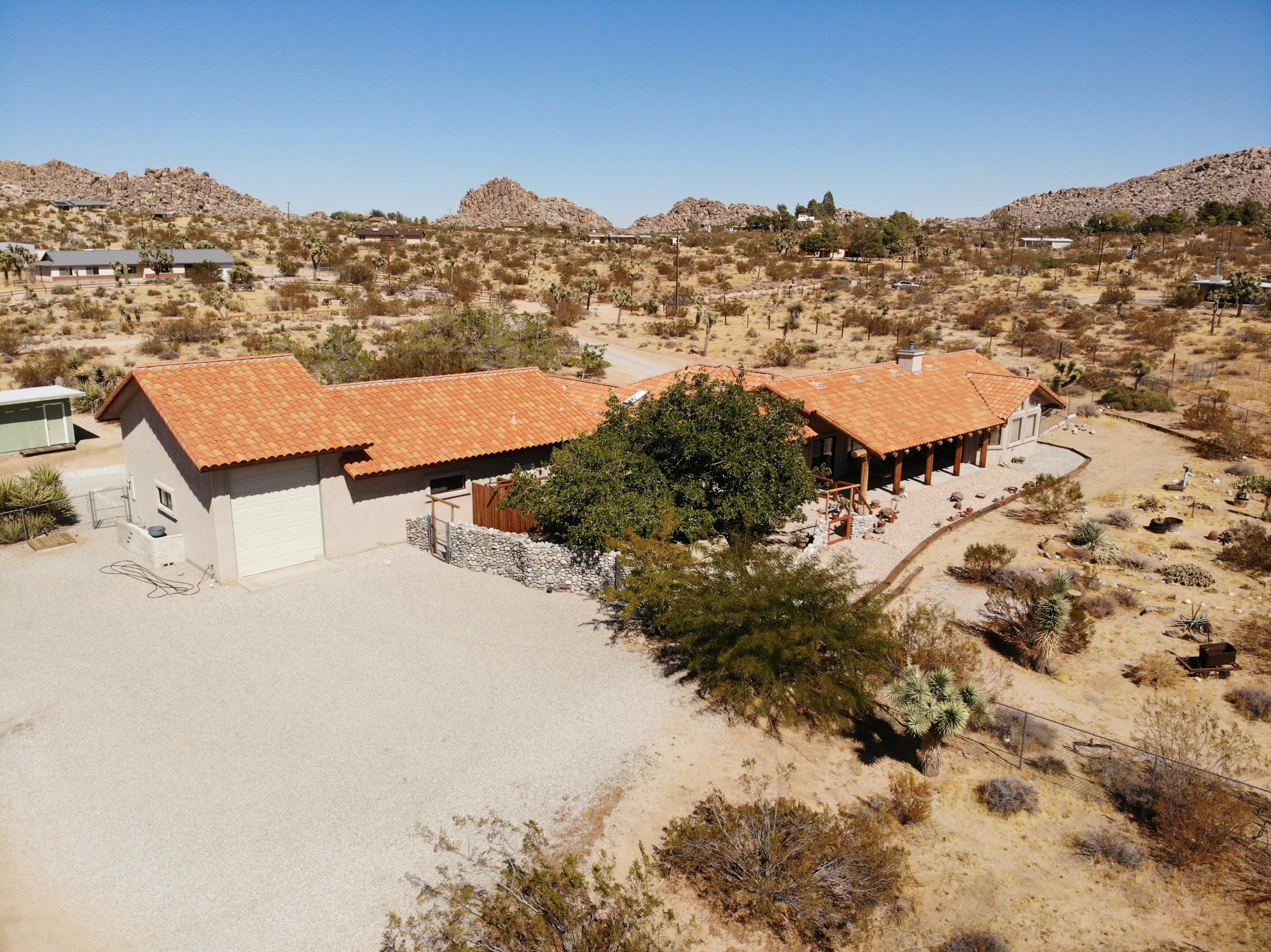 63533 Wagon Wheel Road Joshua Tree, CA 92252 - Photo 62 of 62 an aerial view of houses with a outdoor space