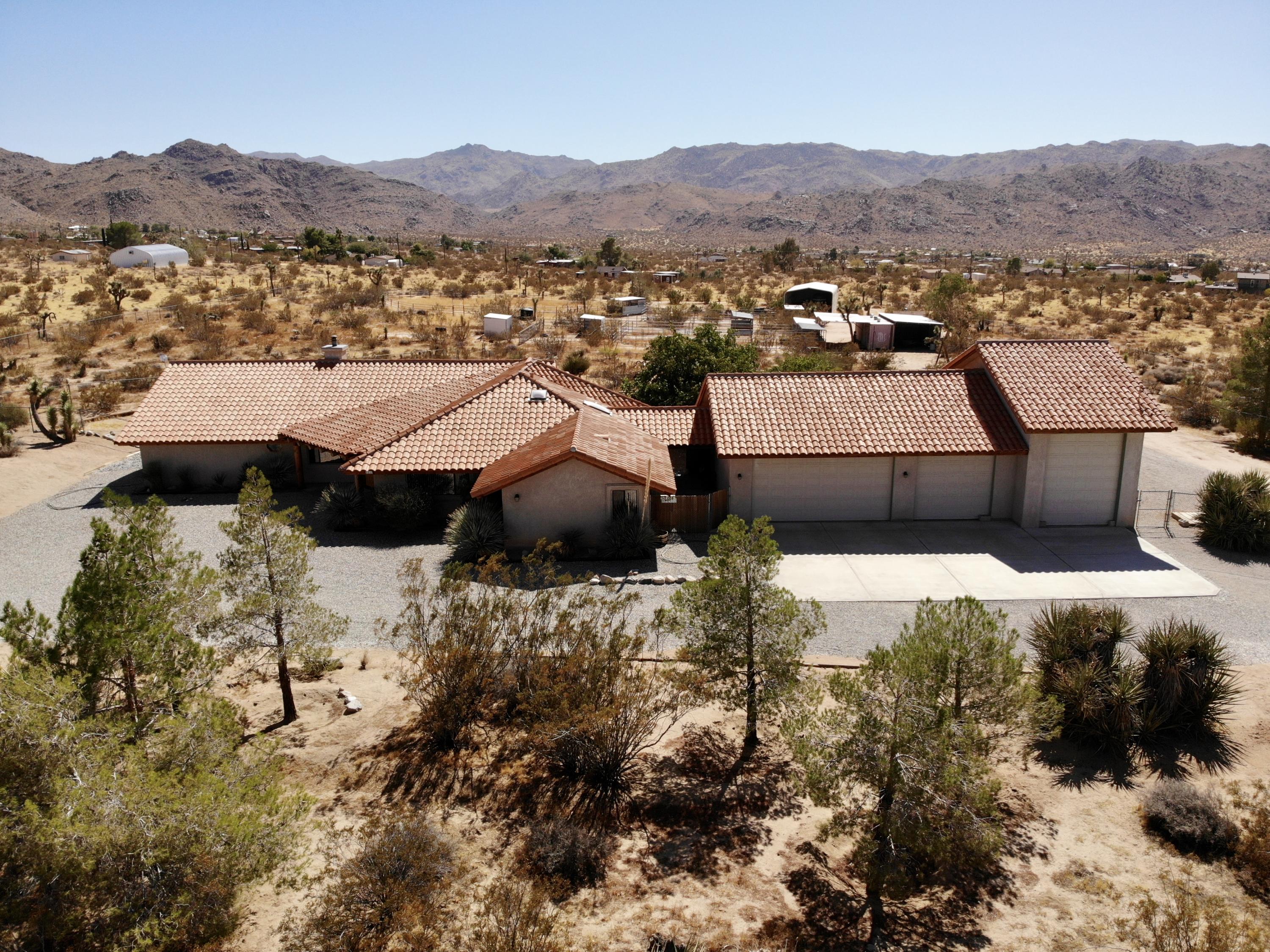 63533 Wagon Wheel Road Joshua Tree, CA 92252 - Photo 9 of 62 a view of a town with mountains in the background