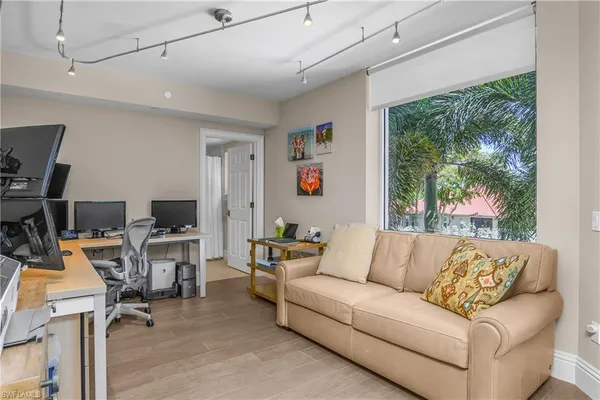 a living room with furniture and a large window