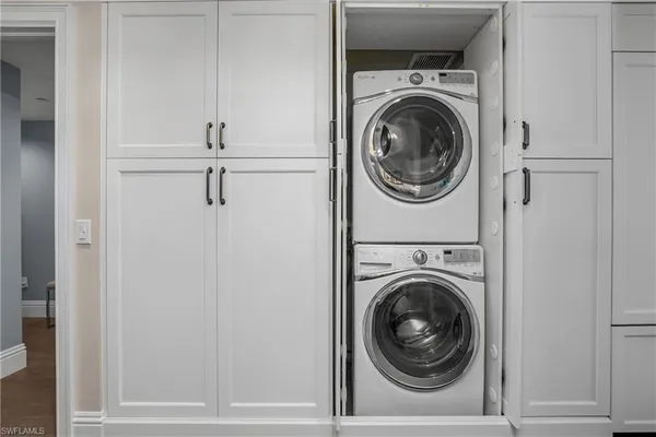 a view of a hallway with washer and dryer