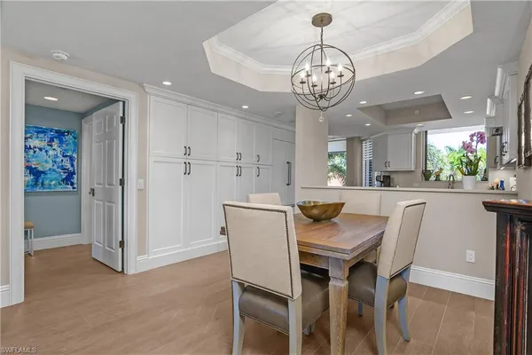 a view of a dining room and chandelier