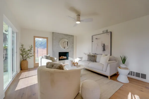 a living room with furniture and a fireplace