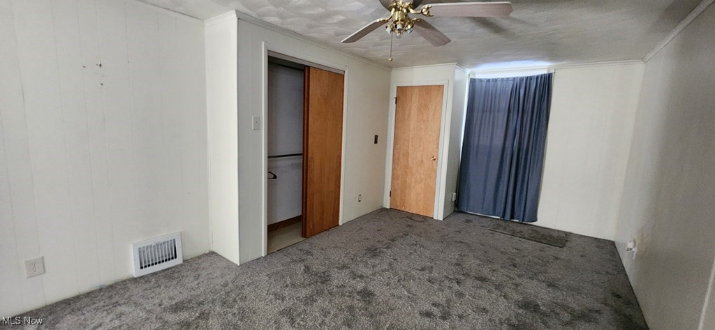 125 Rockdale Road Follansbee, WV 26037 - Photo 9 of 19 Unfurnished bedroom featuring carpet floors, a ceiling fan, and crown molding