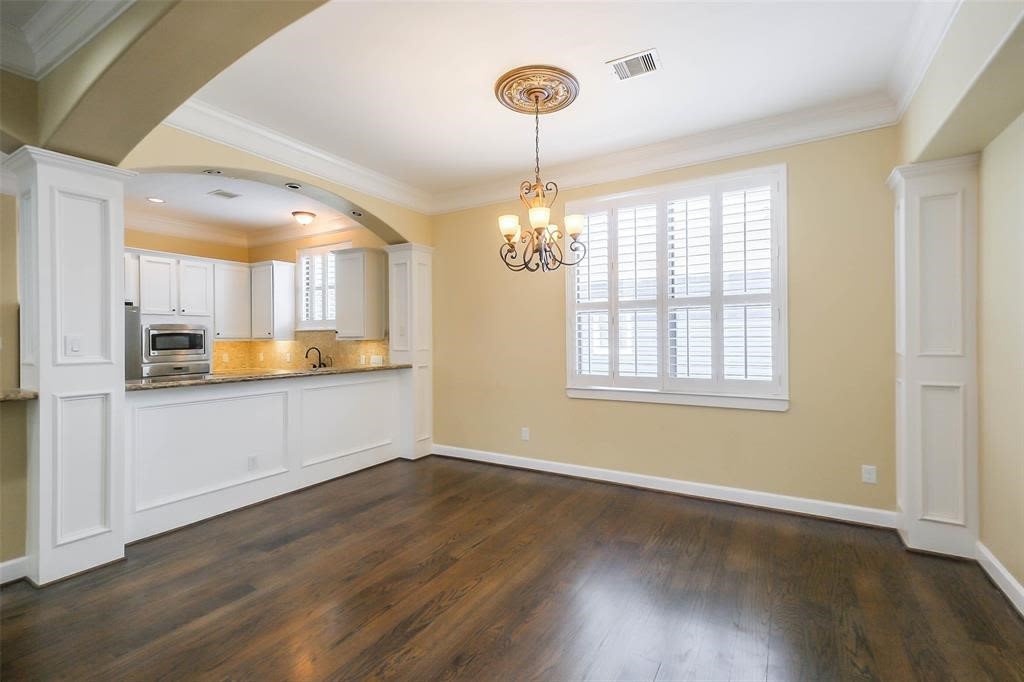 706 Allston Street, Unit B Houston, TX 77007 - Photo 5 of 33 a view of an empty room with kitchen and window