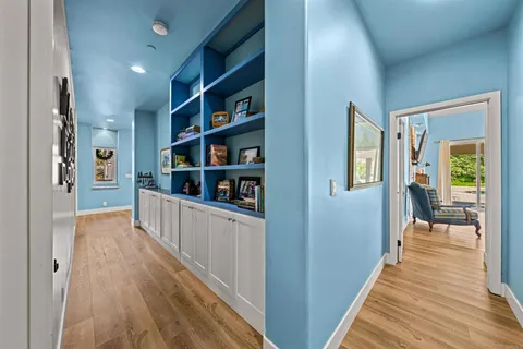 a hallway with cabinets