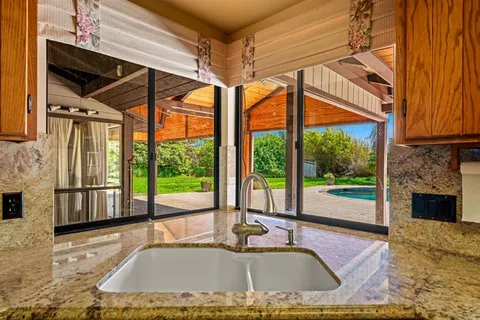 a view of a living room and a fireplace