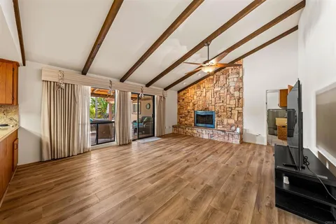 a room with wooden floor and furniture