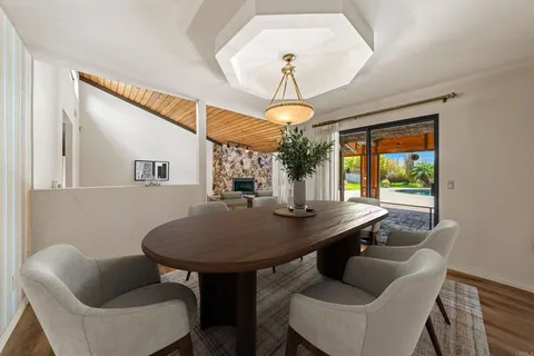 a view of a dining room with furniture window and outside view