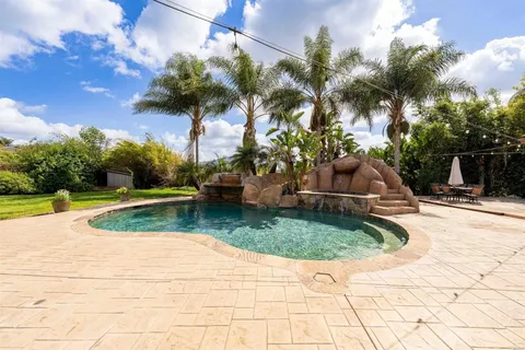 a view of a backyard of the house