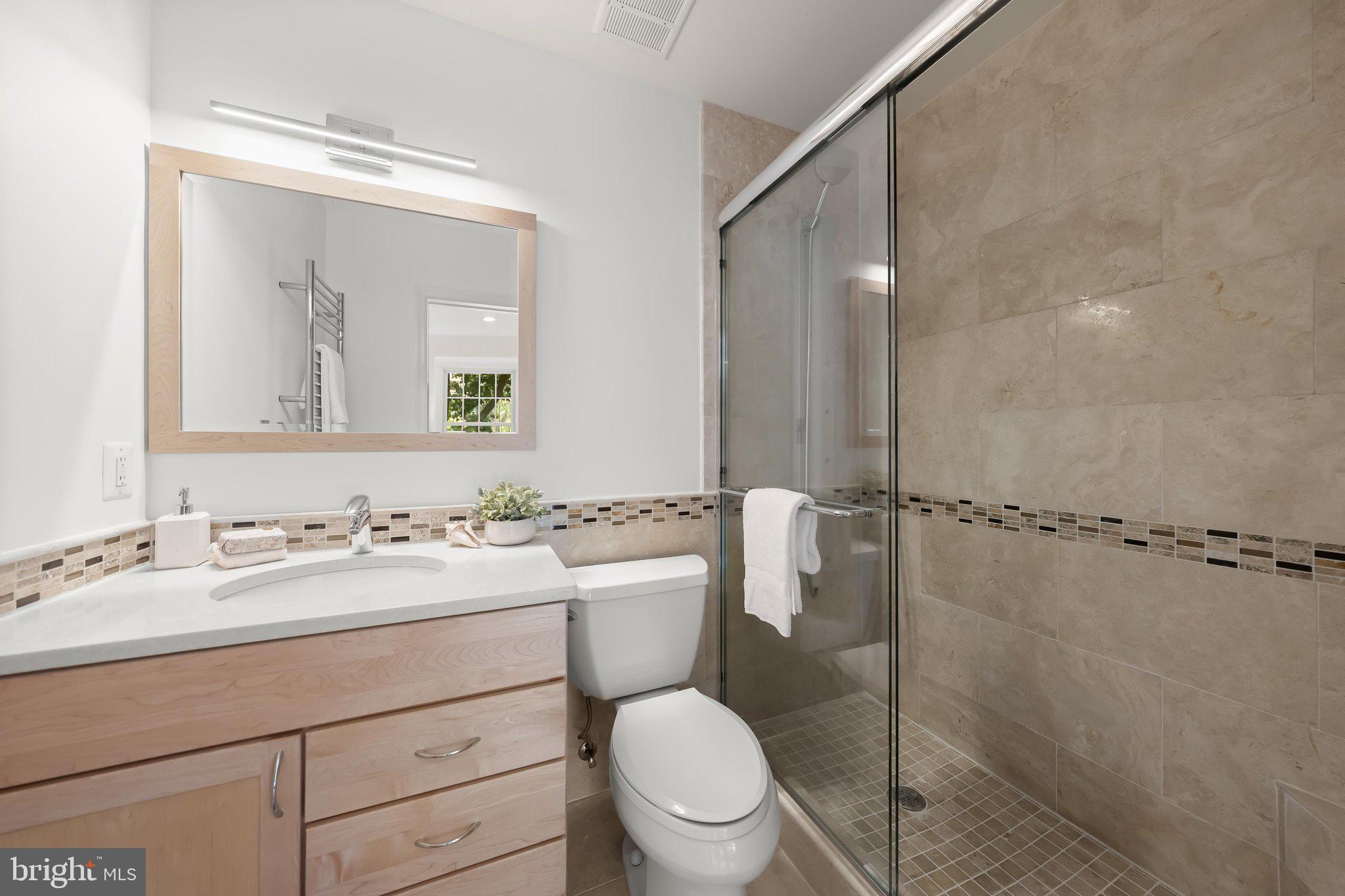 3229 Sutton Place Northwest, Unit B Washington, DC 20016 - Photo 12 of 24 En suite Full Bathroom with heated towel rack