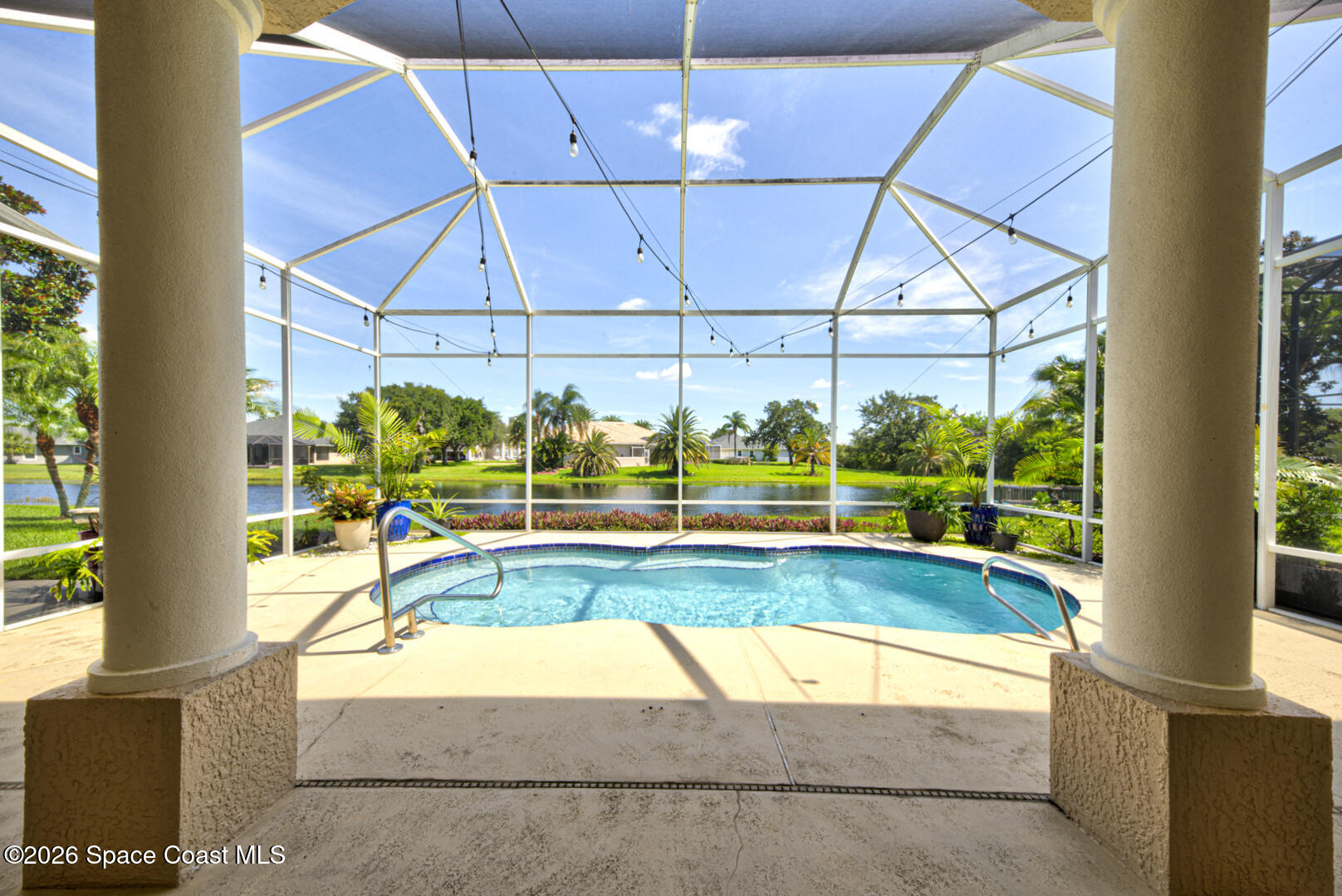 4070 Stoney Point Road Melbourne, FL 32940 - Photo 61 of 78 screened-in pool with lake view