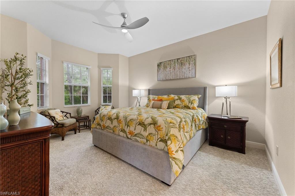 7837 Hawthorne Drive, Unit 1101 Naples, FL 34113 - Photo 11 of 41 a bedroom with a bed and window