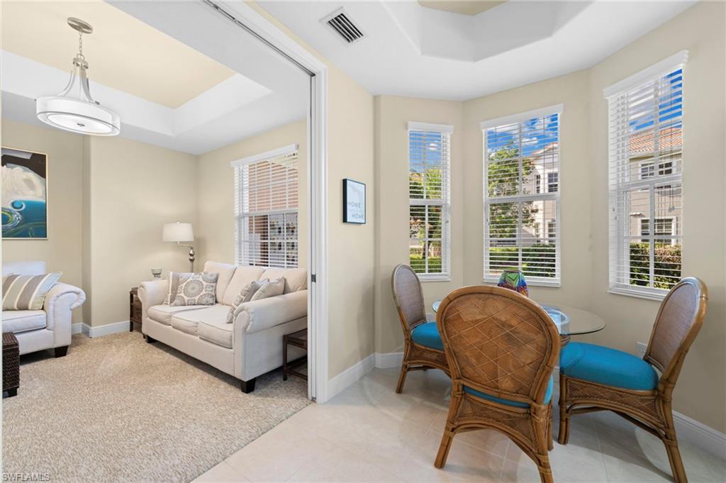 7837 Hawthorne Drive, Unit 1101 Naples, FL 34113 - Photo 20 of 41 a living room with furniture and a large window
