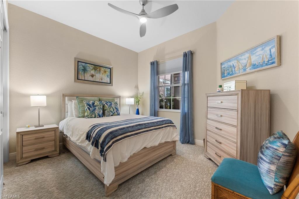 7837 Hawthorne Drive, Unit 1101 Naples, FL 34113 - Photo 28 of 41 a spacious bedroom with a bed and a window