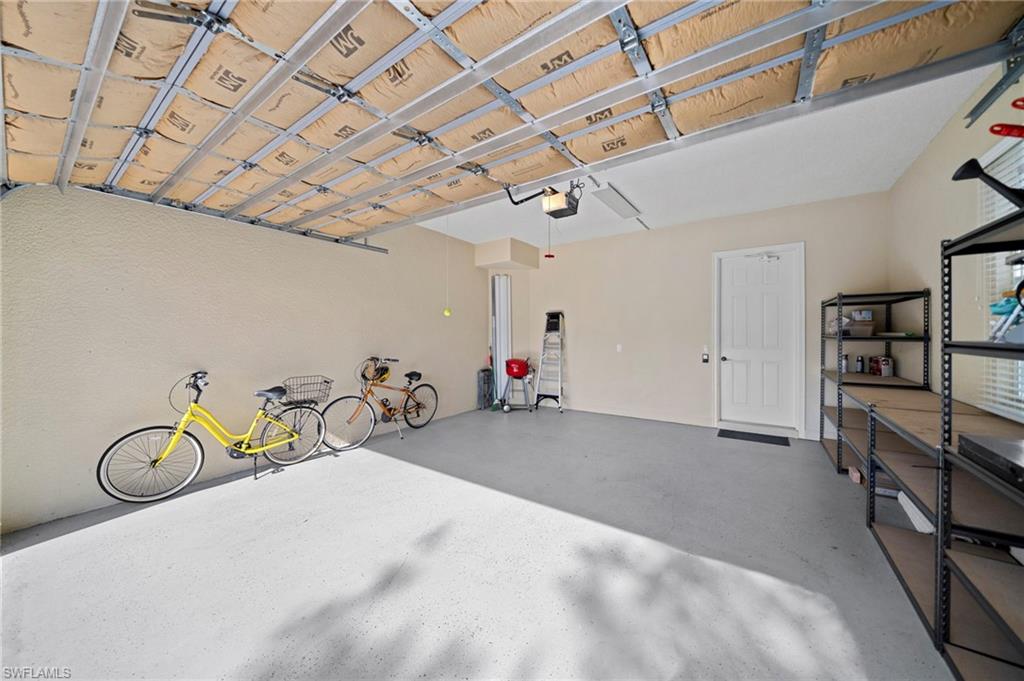 7837 Hawthorne Drive, Unit 1101 Naples, FL 34113 - Photo 30 of 41 a view of a room with gym equipment