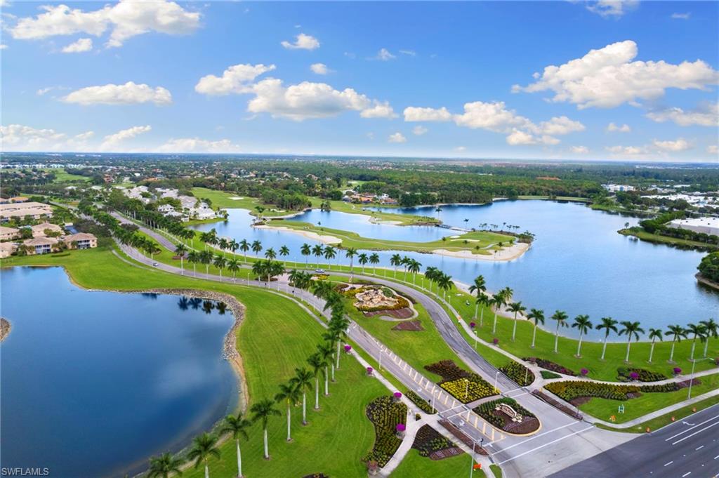 7837 Hawthorne Drive, Unit 1101 Naples, FL 34113 - Photo 40 of 41 an aerial view of a golf course with swimming pool and outdoor seating