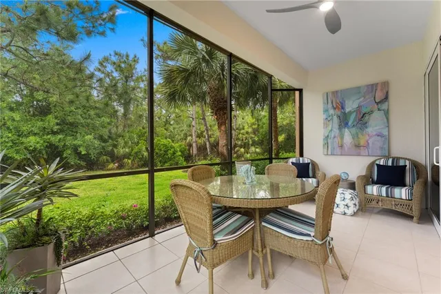a dining room with furniture and garden view