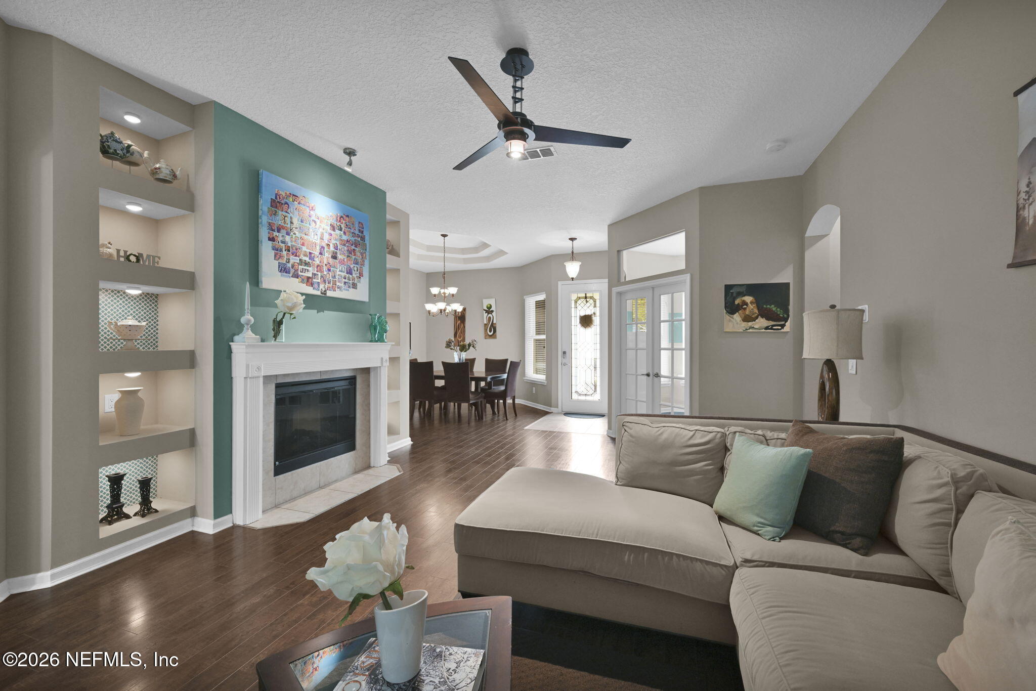 6191 White Tip Road Jacksonville, FL 32258 - Photo 15 of 58 a living room with furniture flat screen tv and a fireplace