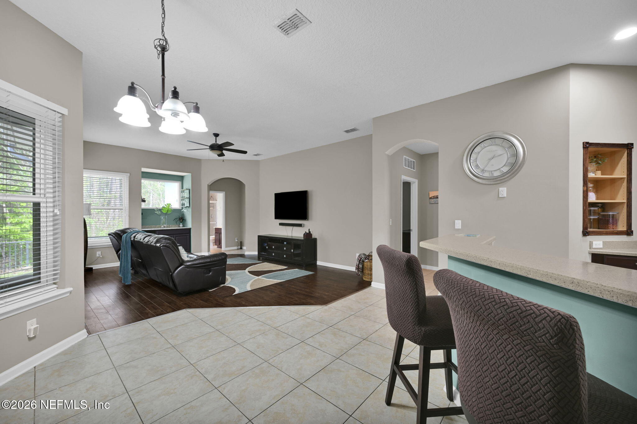 6191 White Tip Road Jacksonville, FL 32258 - Photo 16 of 58 a living room with furniture chandelier and a window