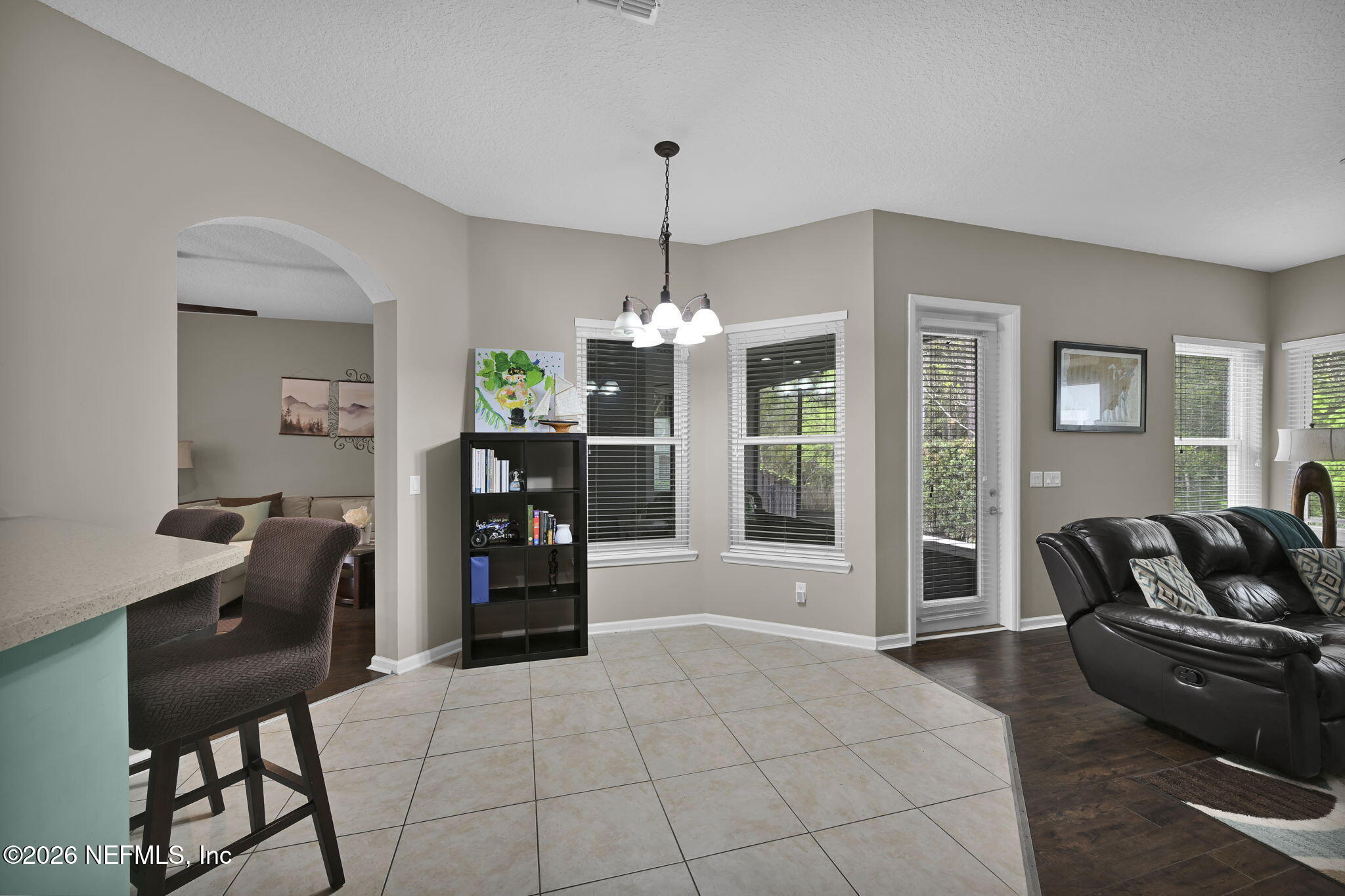 6191 White Tip Road Jacksonville, FL 32258 - Photo 17 of 58 a living room with furniture and large windows