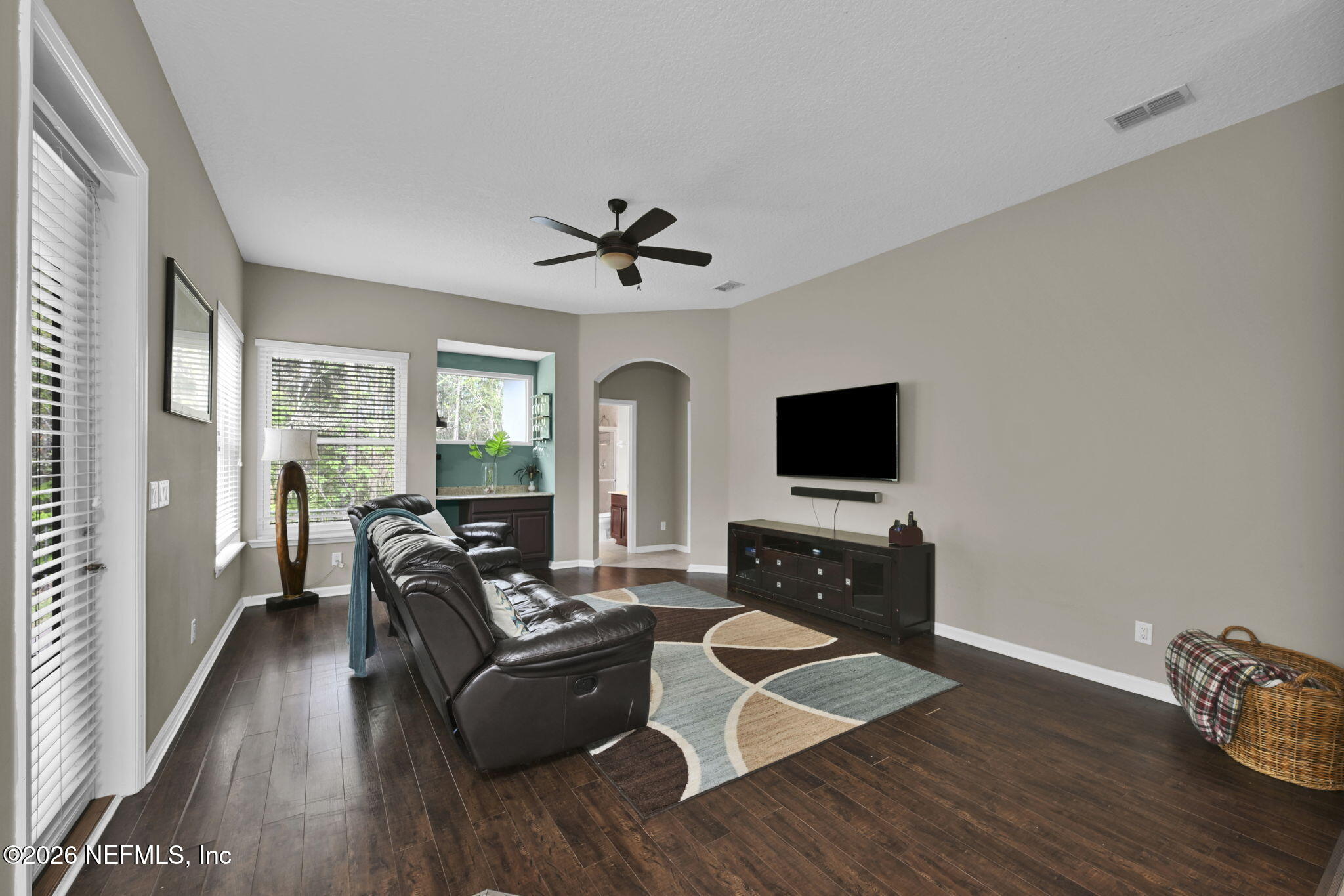 6191 White Tip Road Jacksonville, FL 32258 - Photo 24 of 58 a living room with furniture fireplace and a flat screen tv
