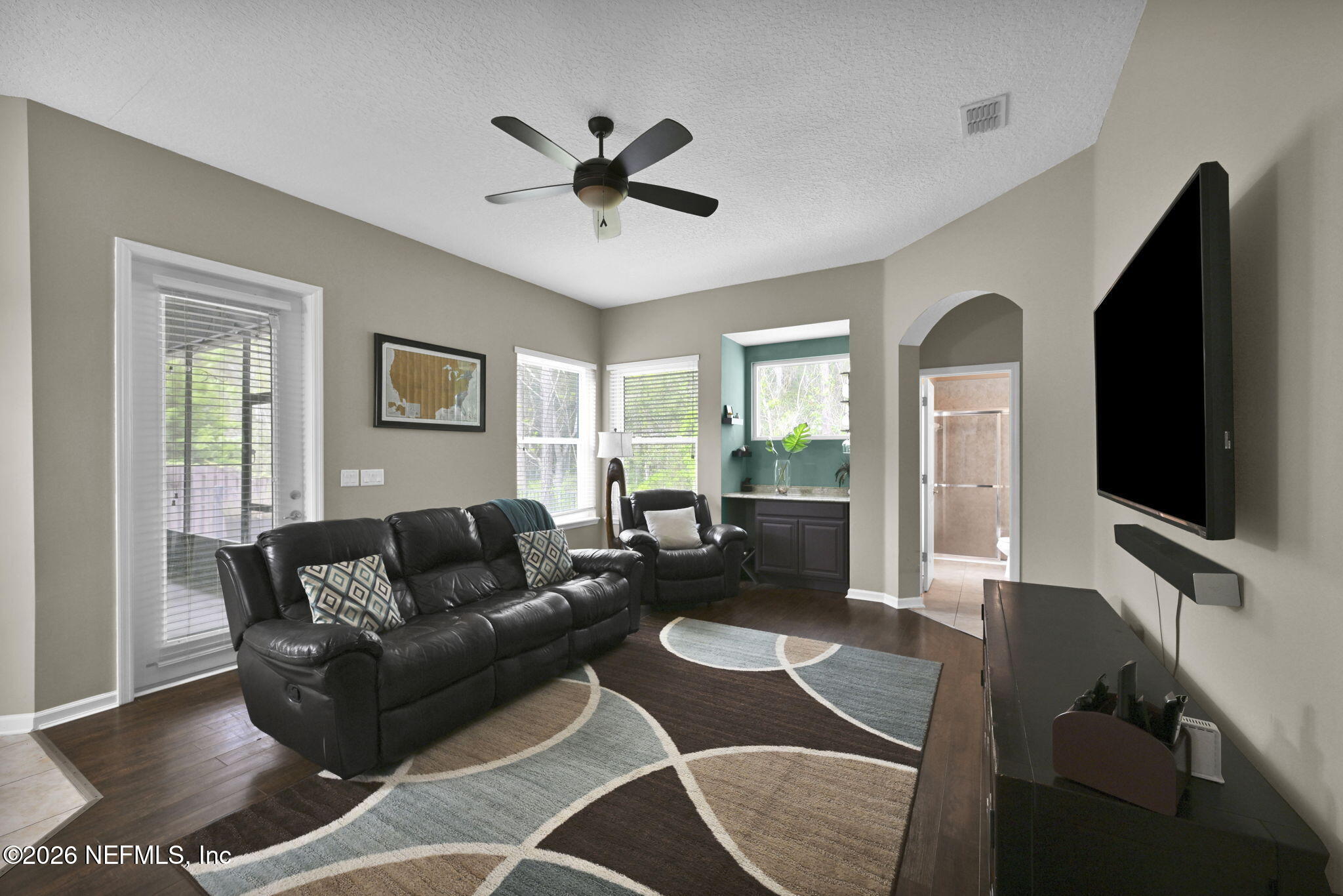 6191 White Tip Road Jacksonville, FL 32258 - Photo 25 of 58 a living room with furniture and a flat screen tv