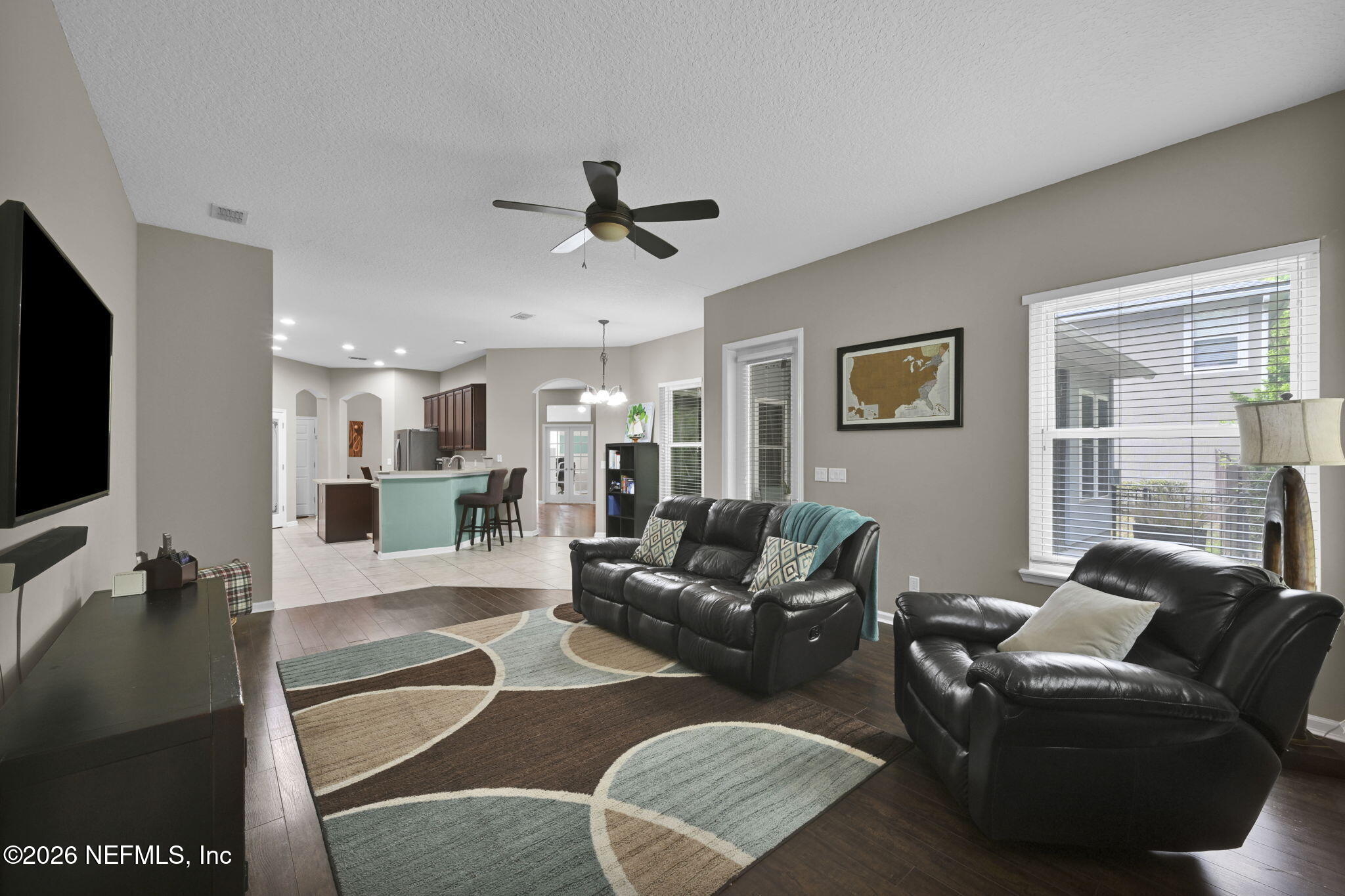 6191 White Tip Road Jacksonville, FL 32258 - Photo 26 of 58 a living room with furniture and a flat screen tv