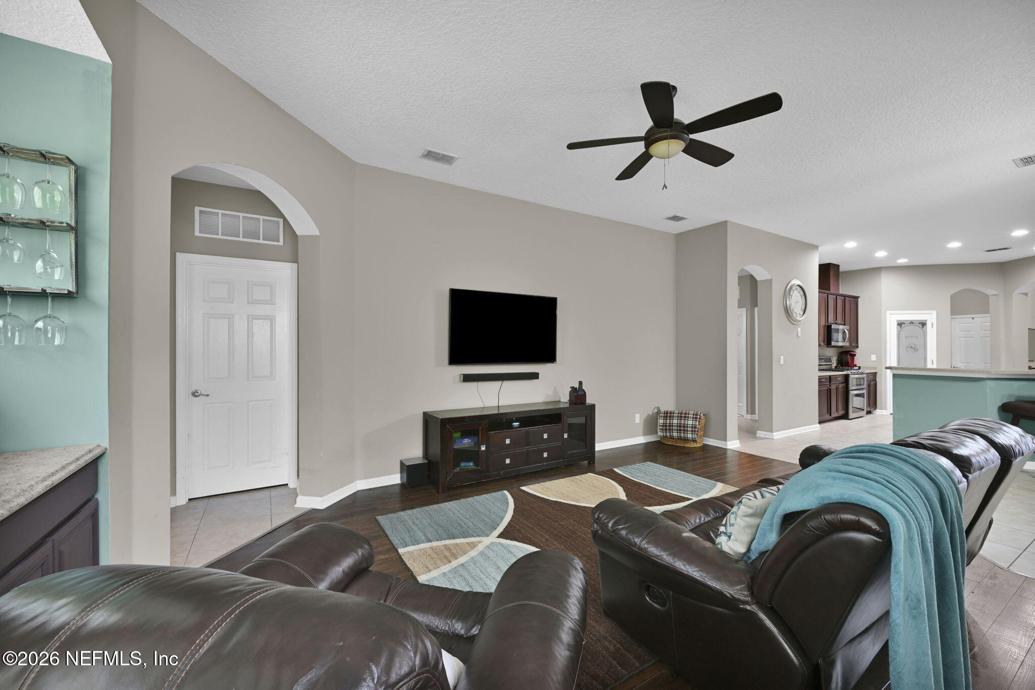 6191 White Tip Road Jacksonville, FL 32258 - Photo 27 of 58 a living room with furniture and a flat screen tv