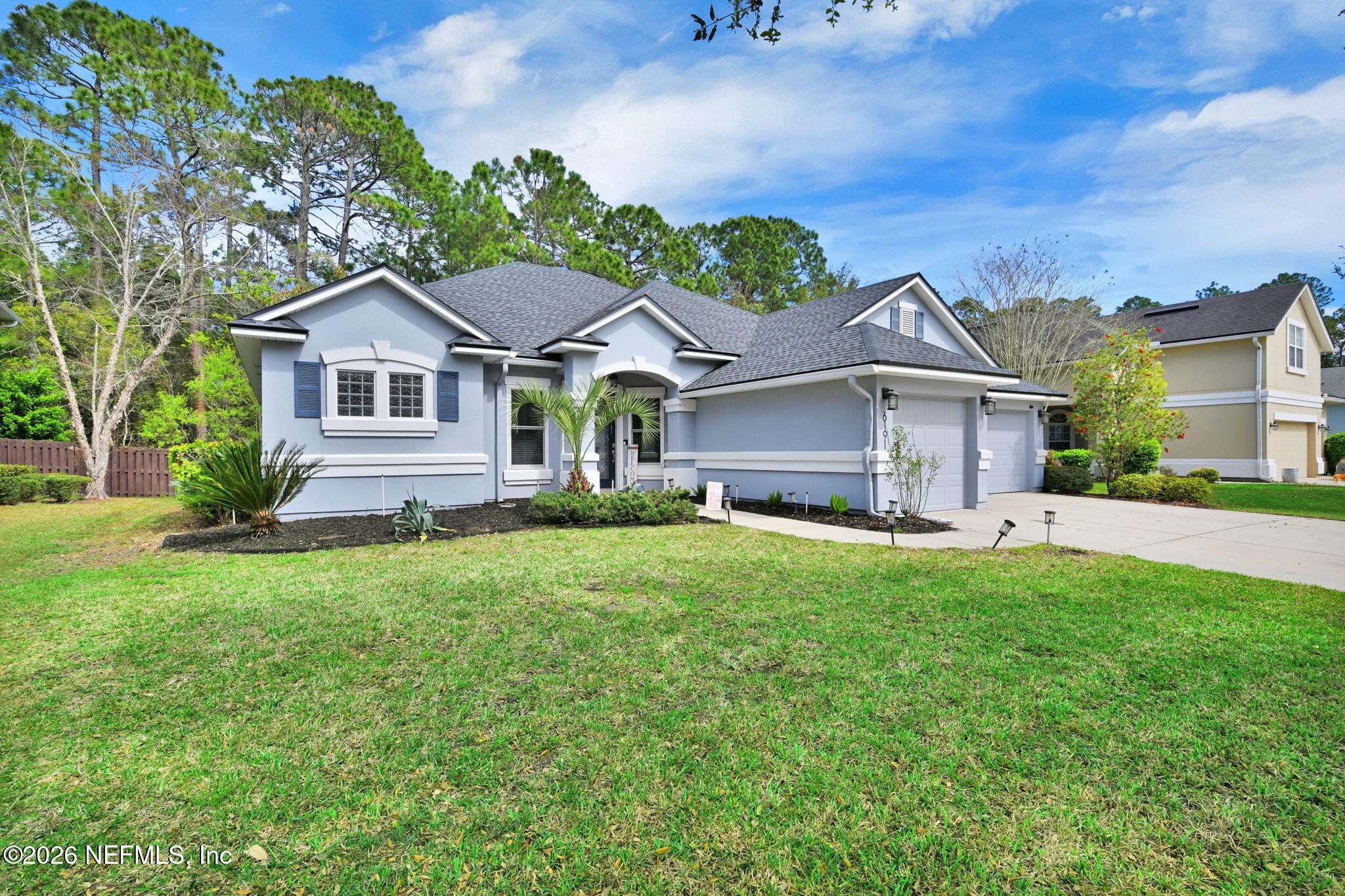 6191 White Tip Road Jacksonville, FL 32258 - Photo 3 of 58 a front view of a house with a garden