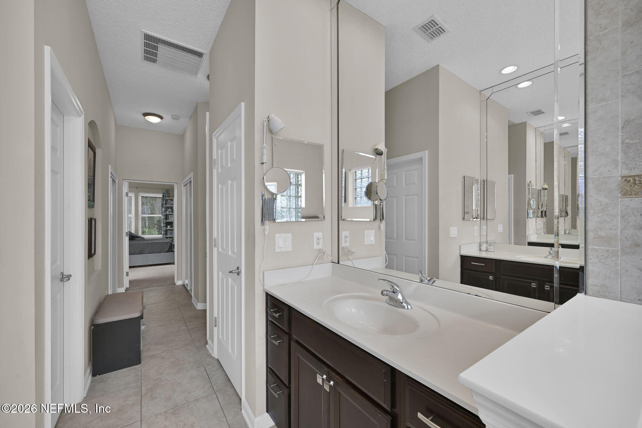 6191 White Tip Road Jacksonville, FL 32258 - Photo 37 of 58 a bathroom with a sink tub shower and a mirror