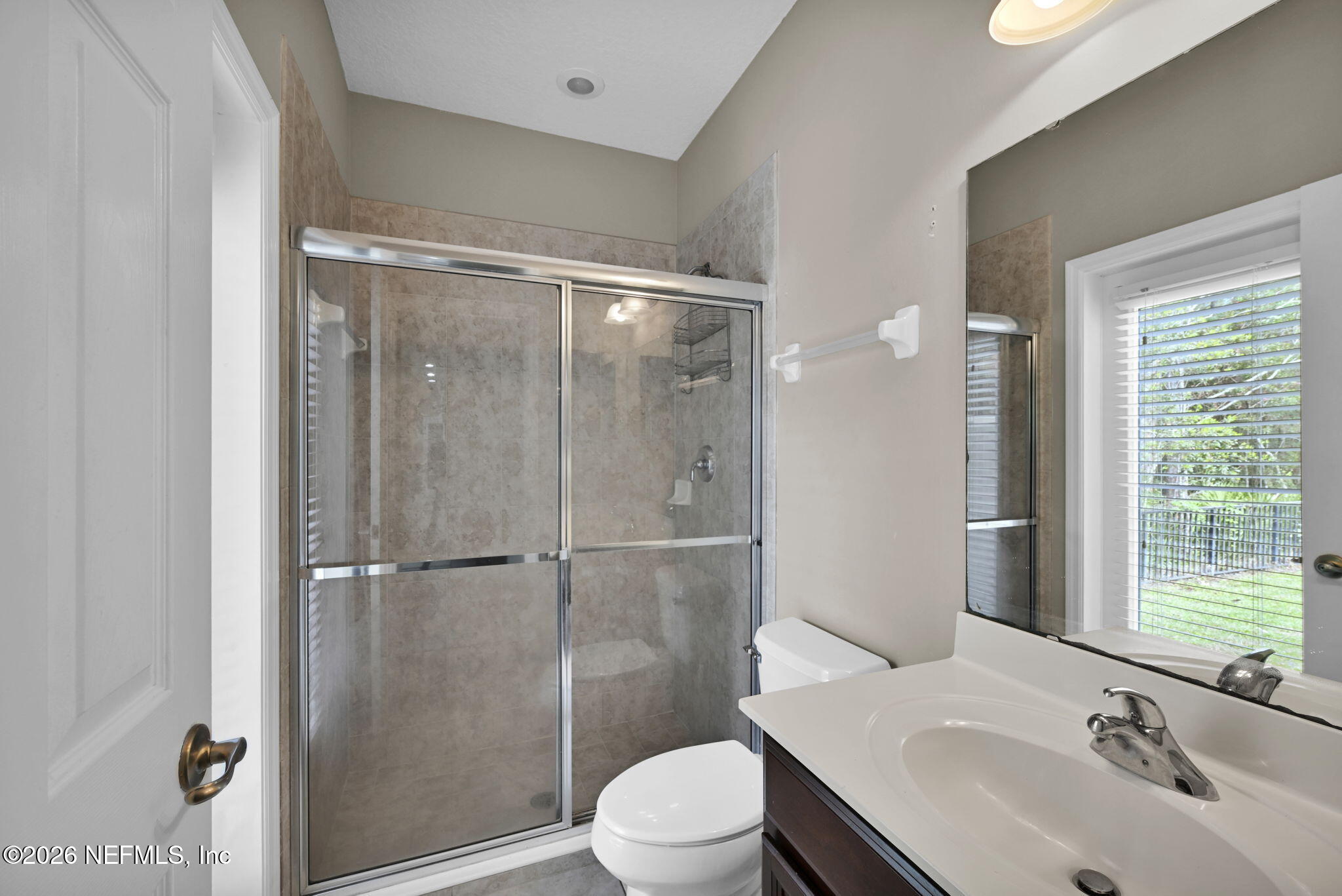 6191 White Tip Road Jacksonville, FL 32258 - Photo 41 of 58 a bathroom with a sink toilet and shower