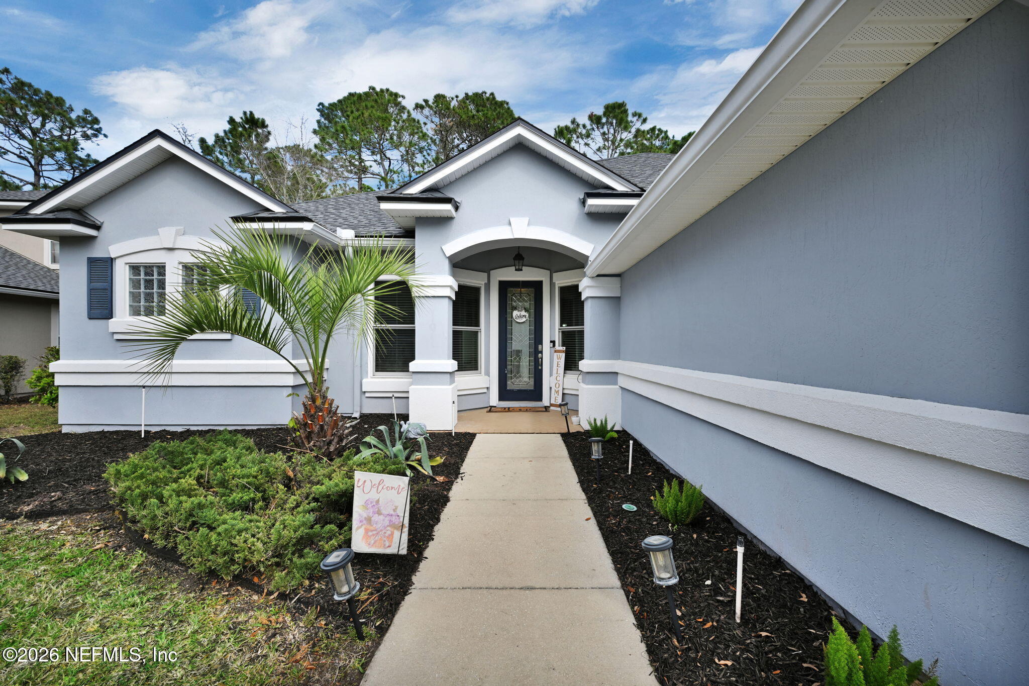 6191 White Tip Road Jacksonville, FL 32258 - Photo 5 of 58 a view of house with a yard and potted plants