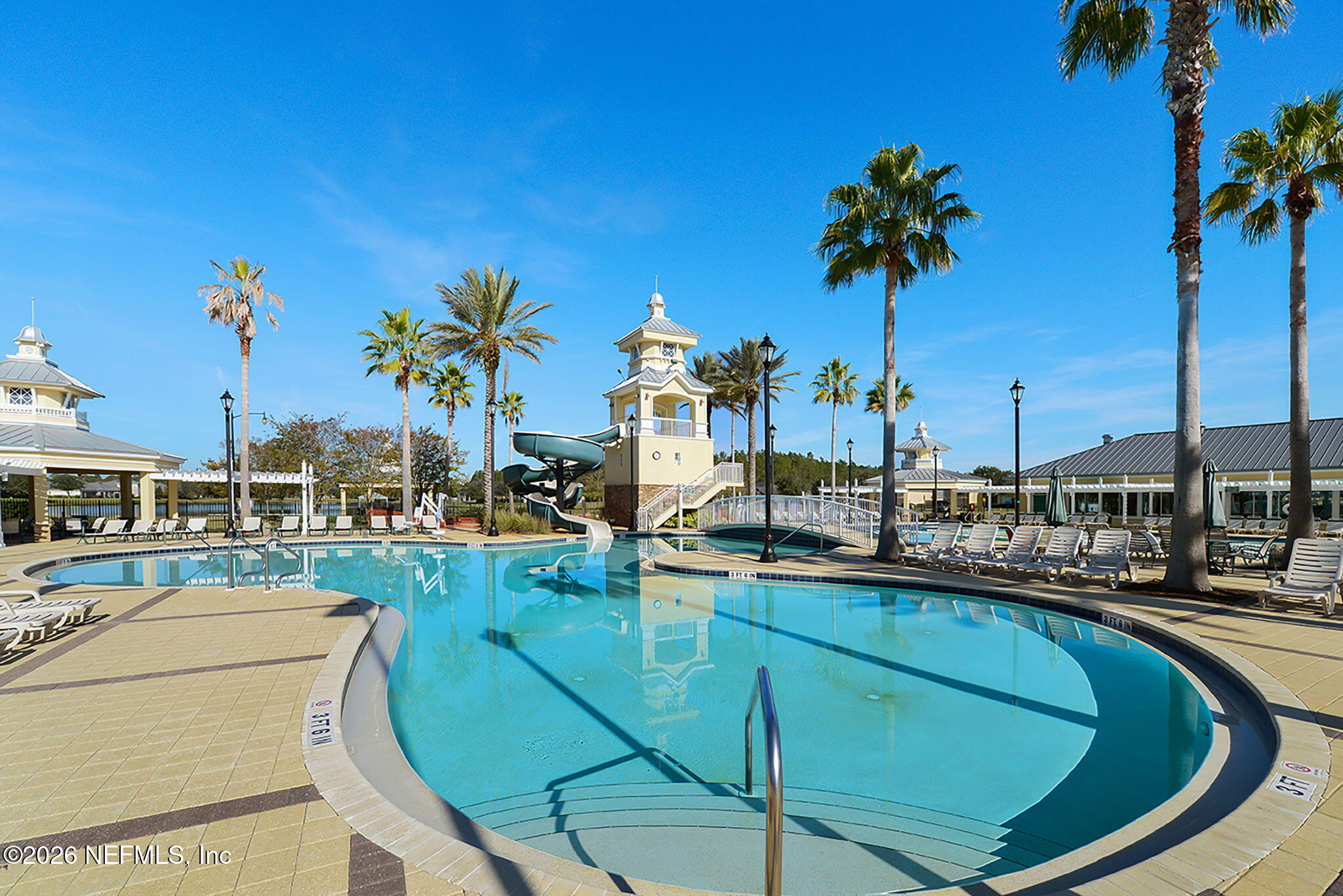 6191 White Tip Road Jacksonville, FL 32258 - Photo 52 of 58 a view of a swimming pool with a lounge chair and palm trees