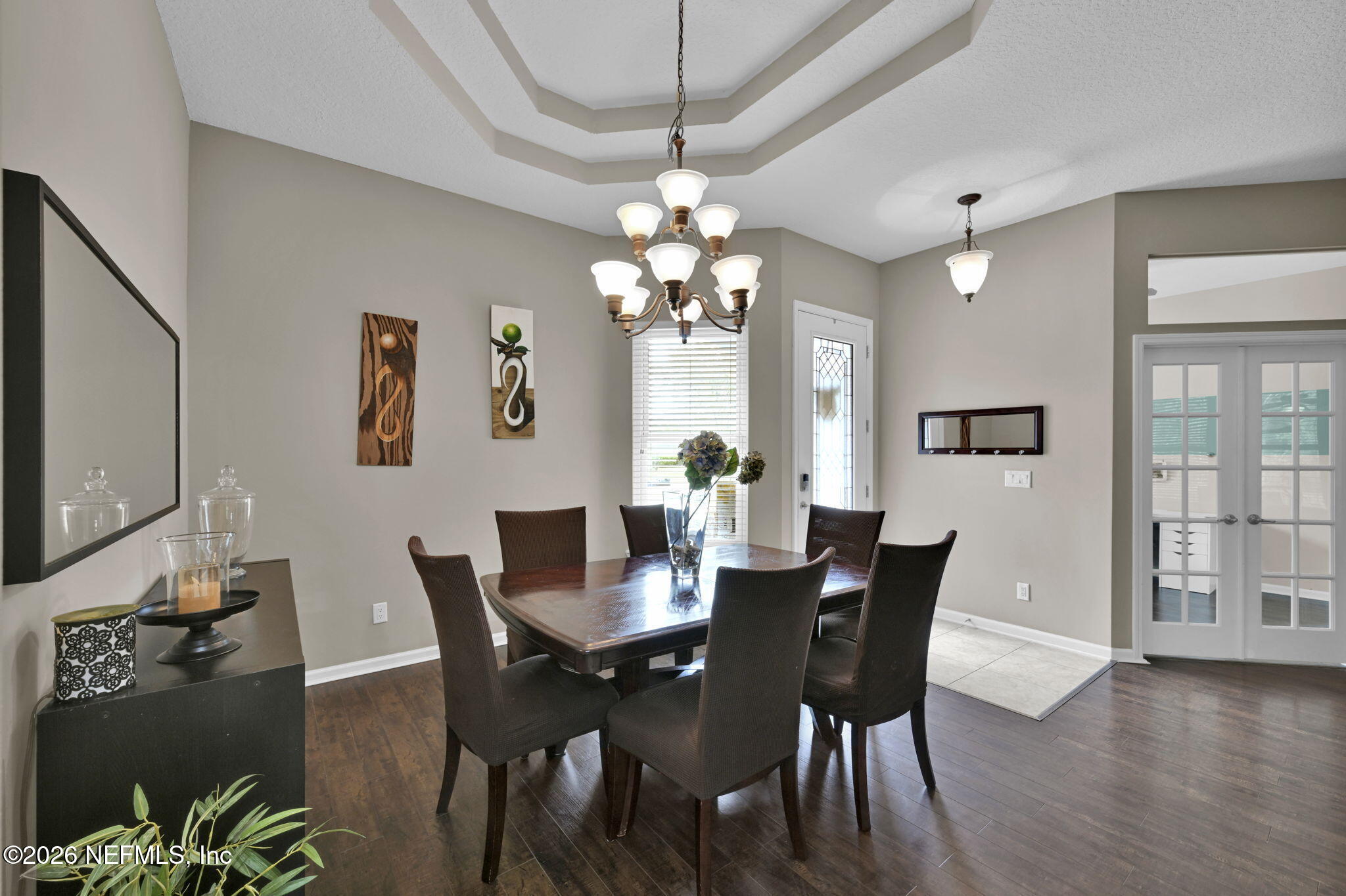 6191 White Tip Road Jacksonville, FL 32258 - Photo 10 of 58 a view of a dining room with furniture and wooden floor