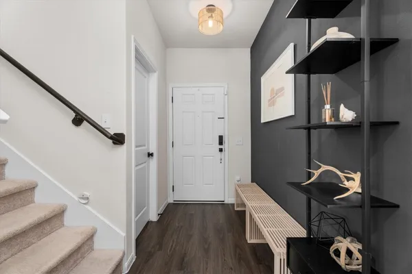 a view of entryway with wooden floor