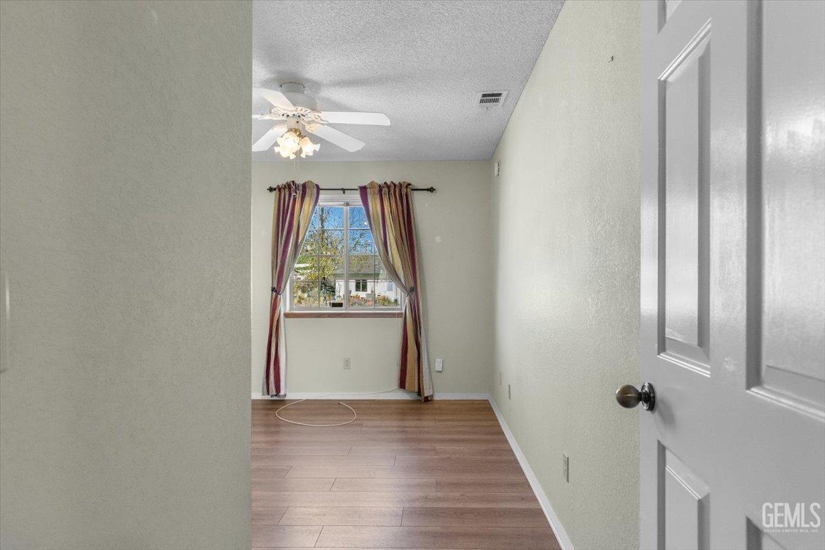 Undisclosed Address Tehachapi, CA 93561 - Photo 17 of 46 wooden floor in an empty room with a window