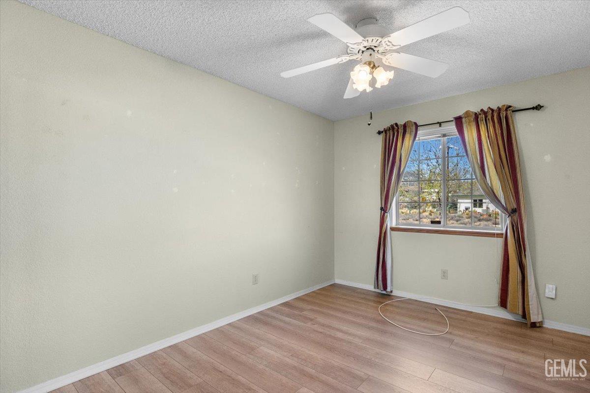 Undisclosed Address Tehachapi, CA 93561 - Photo 18 of 46 an empty room with windows and closet