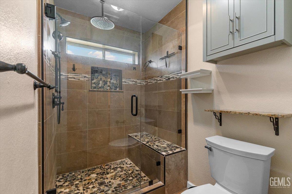 Undisclosed Address Tehachapi, CA 93561 - Photo 29 of 46 a bathroom with a toilet and a shower