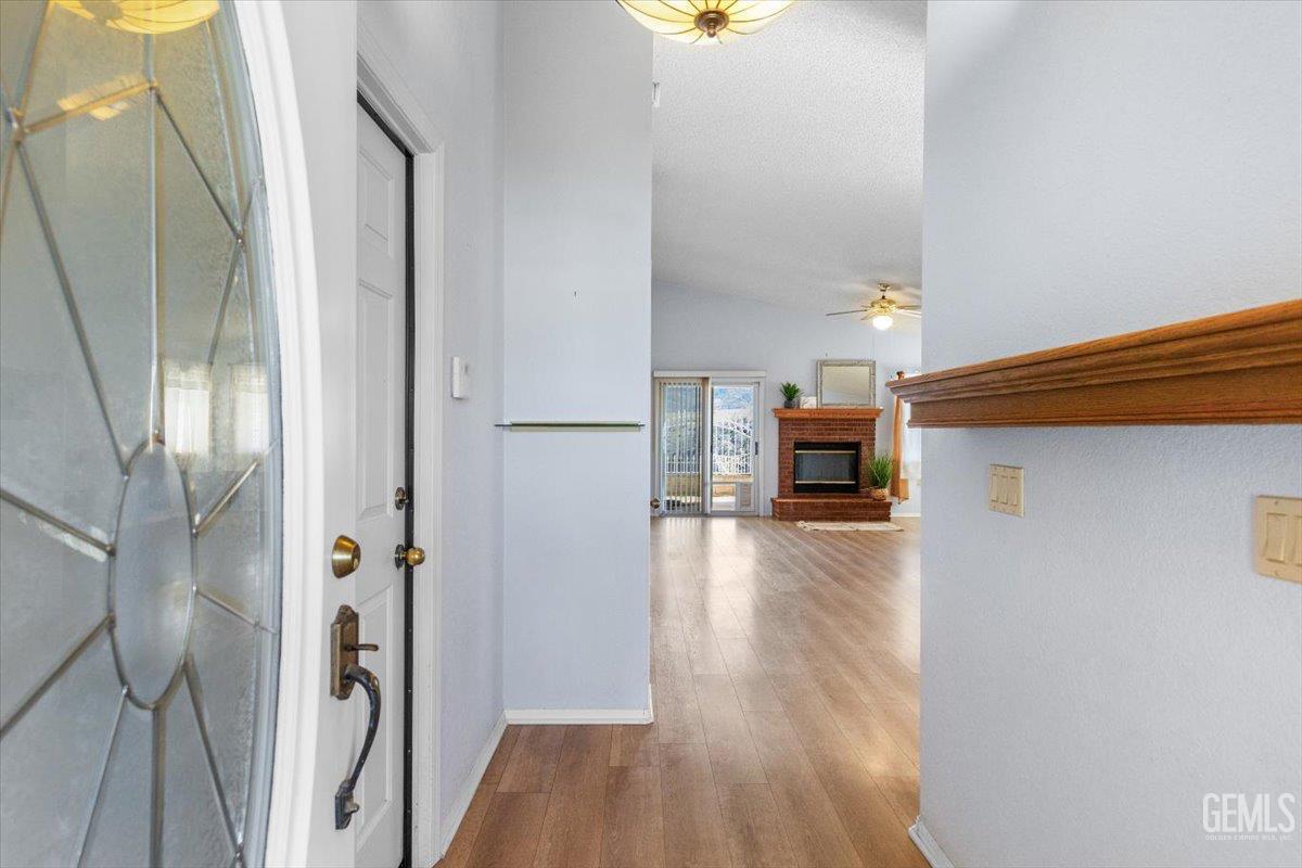 Undisclosed Address Tehachapi, CA 93561 - Photo 4 of 46 a view of a hallway view with wooden floor and staircase