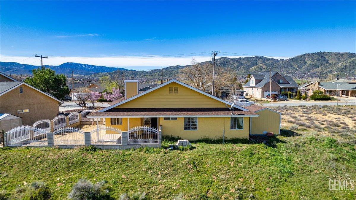 Undisclosed Address Tehachapi, CA 93561 - Photo 42 of 46 a aerial view of a house with a yard and balcony