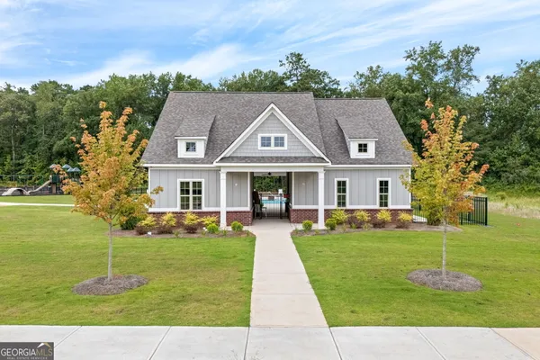 a view of a swimming pool with a patio and yard