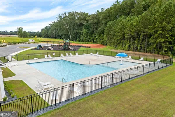 a view of a swimming pool and outdoor space