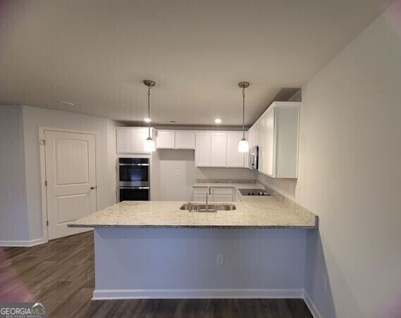 117 Shenandoah Lane, Unit 22D LaGrange, GA 30241 - Photo 3 of 20 a view of kitchen with sink microwave and refrigerator