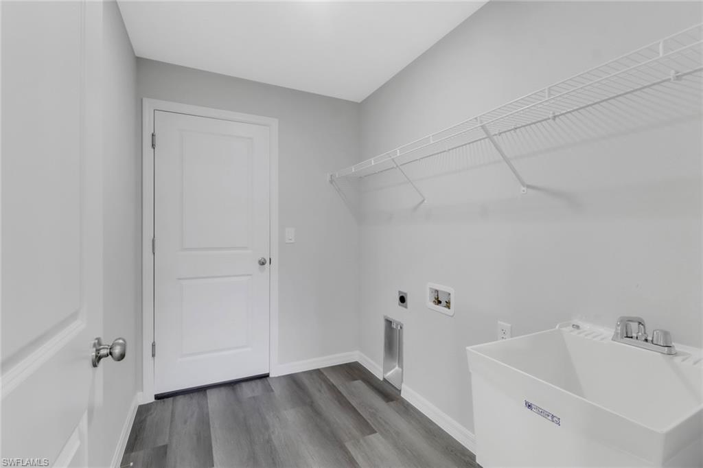 1012 Anza Avenue Lehigh Acres, FL 33971 - Photo 13 of 25 a bathroom with a sink and a tub