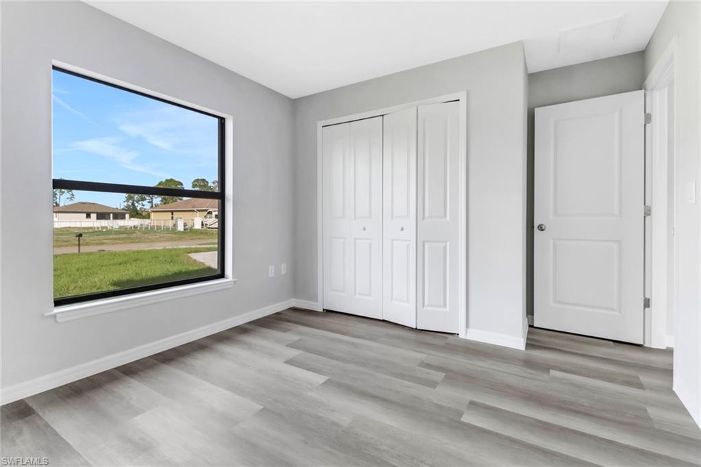 1012 Anza Avenue Lehigh Acres, FL 33971 - Photo 23 of 25 a view of a room with front door