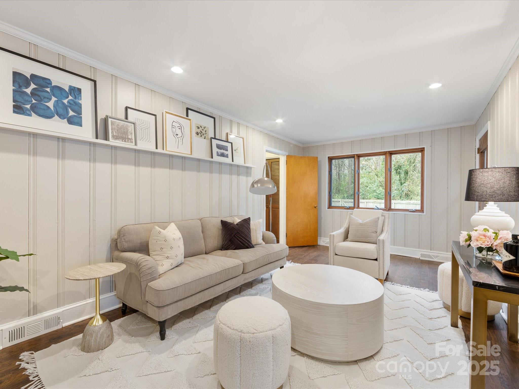 2908 Enfield Road Charlotte, NC 28205 - Photo 12 of 32 a living room with furniture and a large window