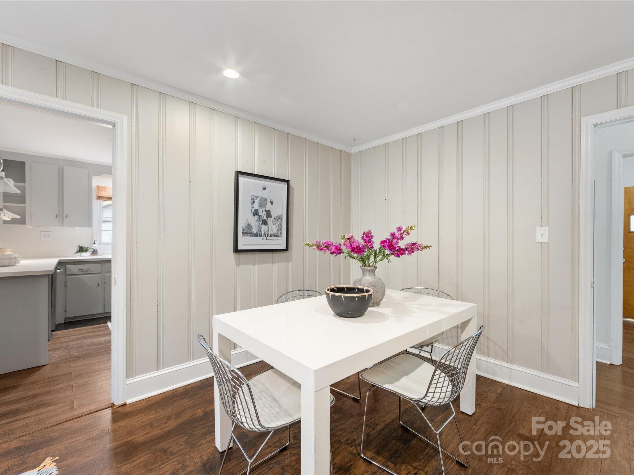 2908 Enfield Road Charlotte, NC 28205 - Photo 16 of 32 a view of a dining room with furniture and wooden floor