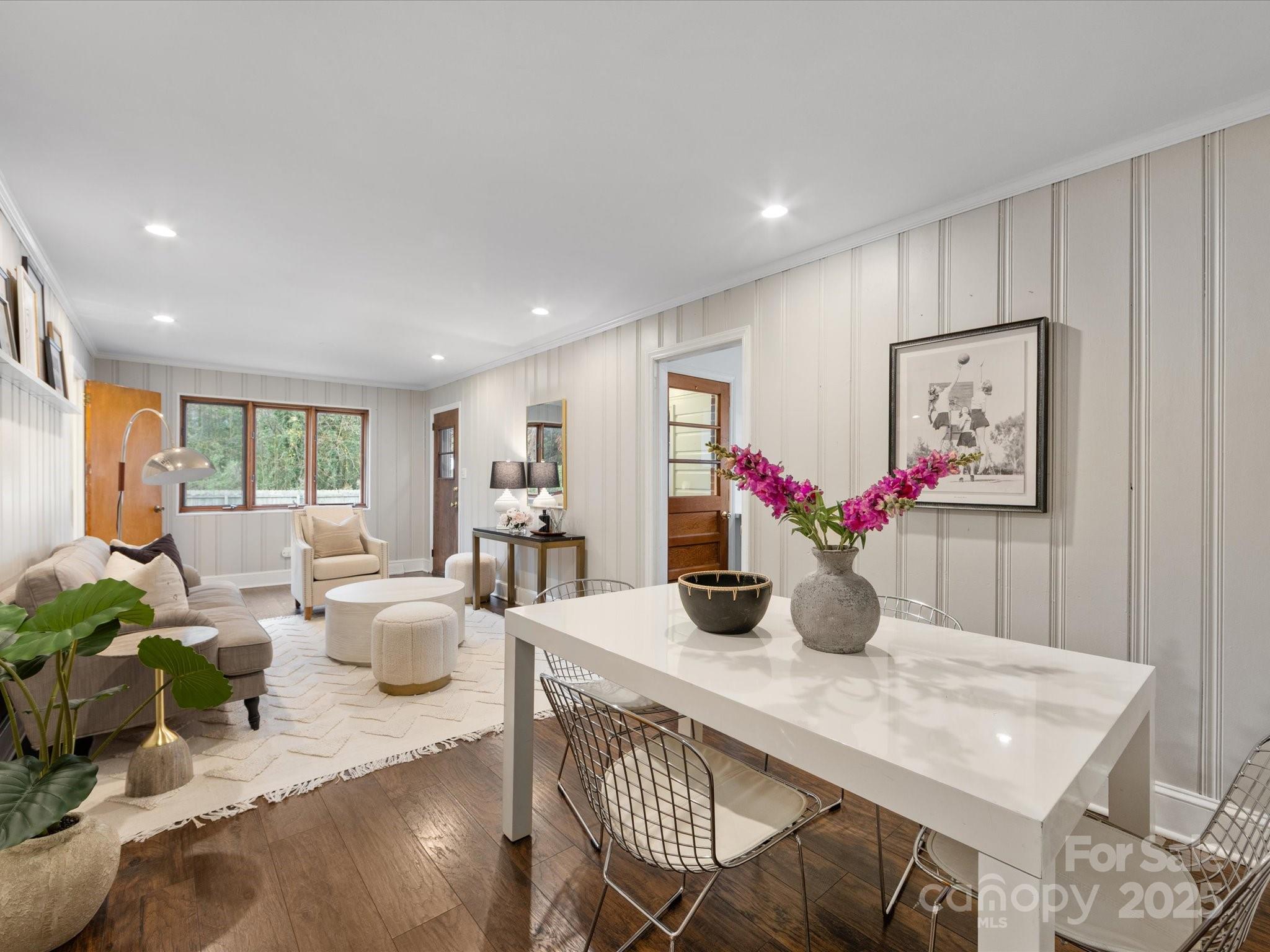 2908 Enfield Road Charlotte, NC 28205 - Photo 17 of 32 a view of a dining room with furniture window and wooden floor