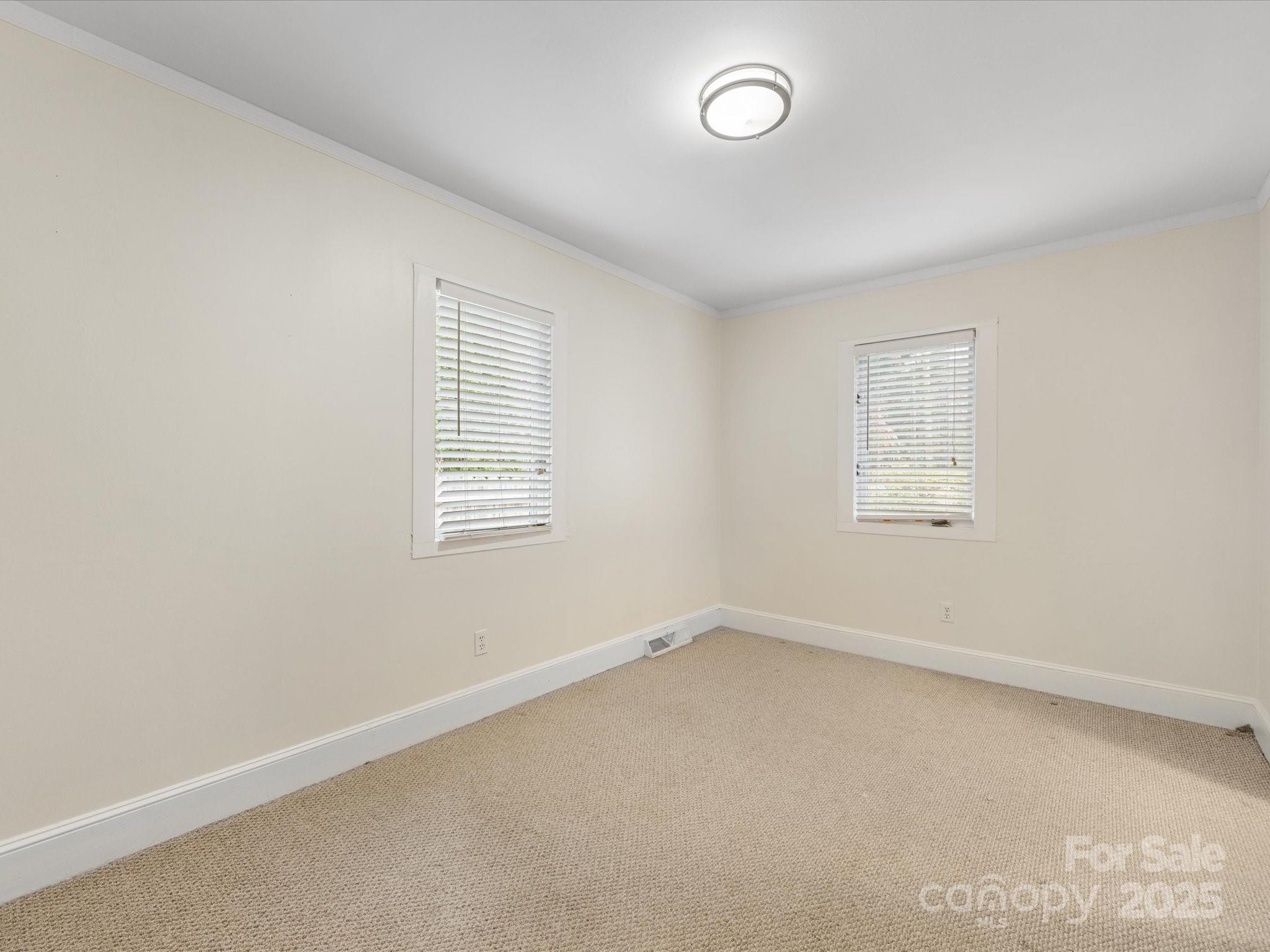 2908 Enfield Road Charlotte, NC 28205 - Photo 26 of 32 an empty room with a window